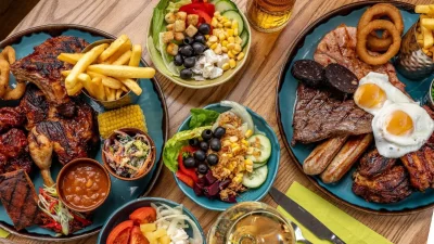 Harvester restaurant exterior featuring the iconic logo and welcoming entrance for family dining and meal deals.