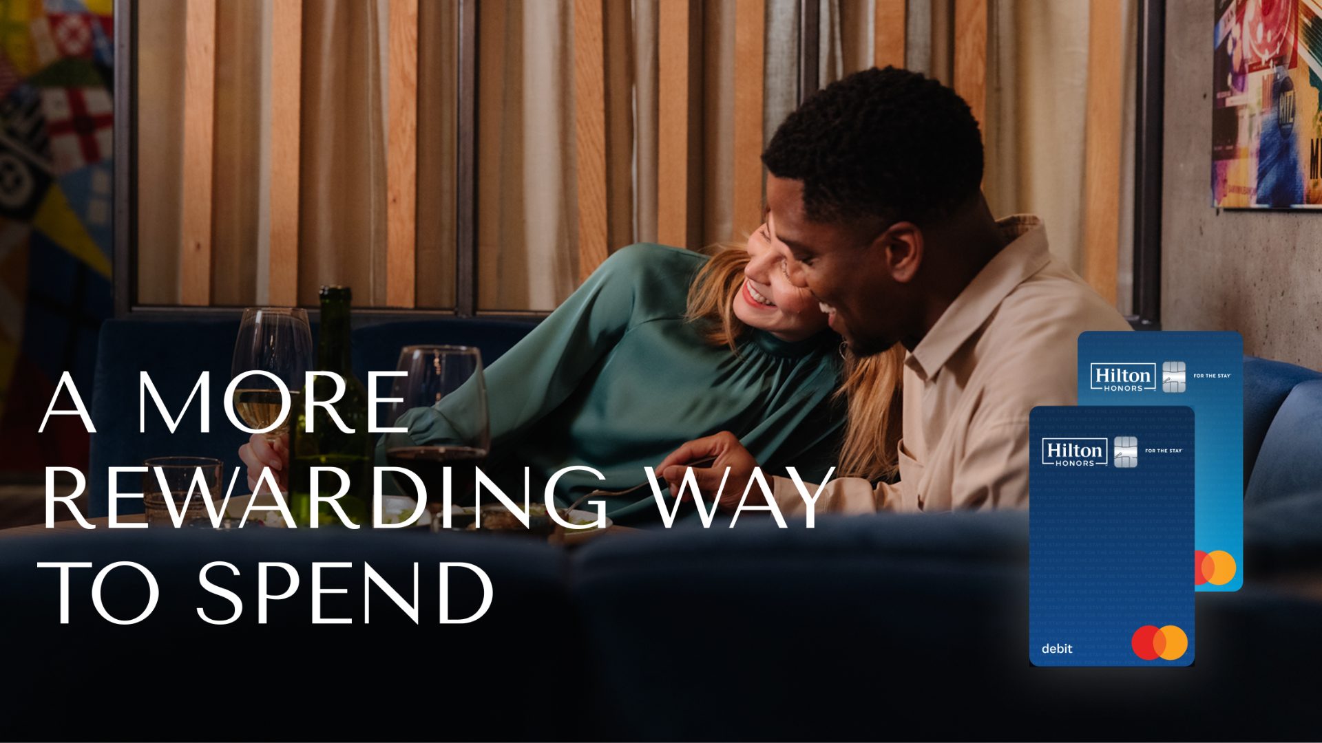 Hilton Honors debit card displayed on a sleek surface, highlighting travel rewards and loyalty programme benefits.
