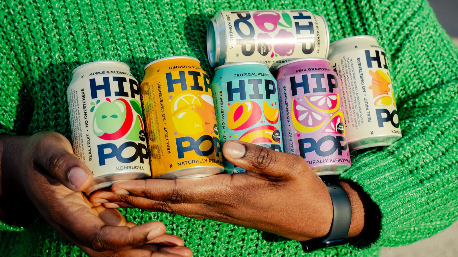 Hip Pop drinks range featuring colourful kombucha bottles and cans, perfect for healthy refreshment and special offers.