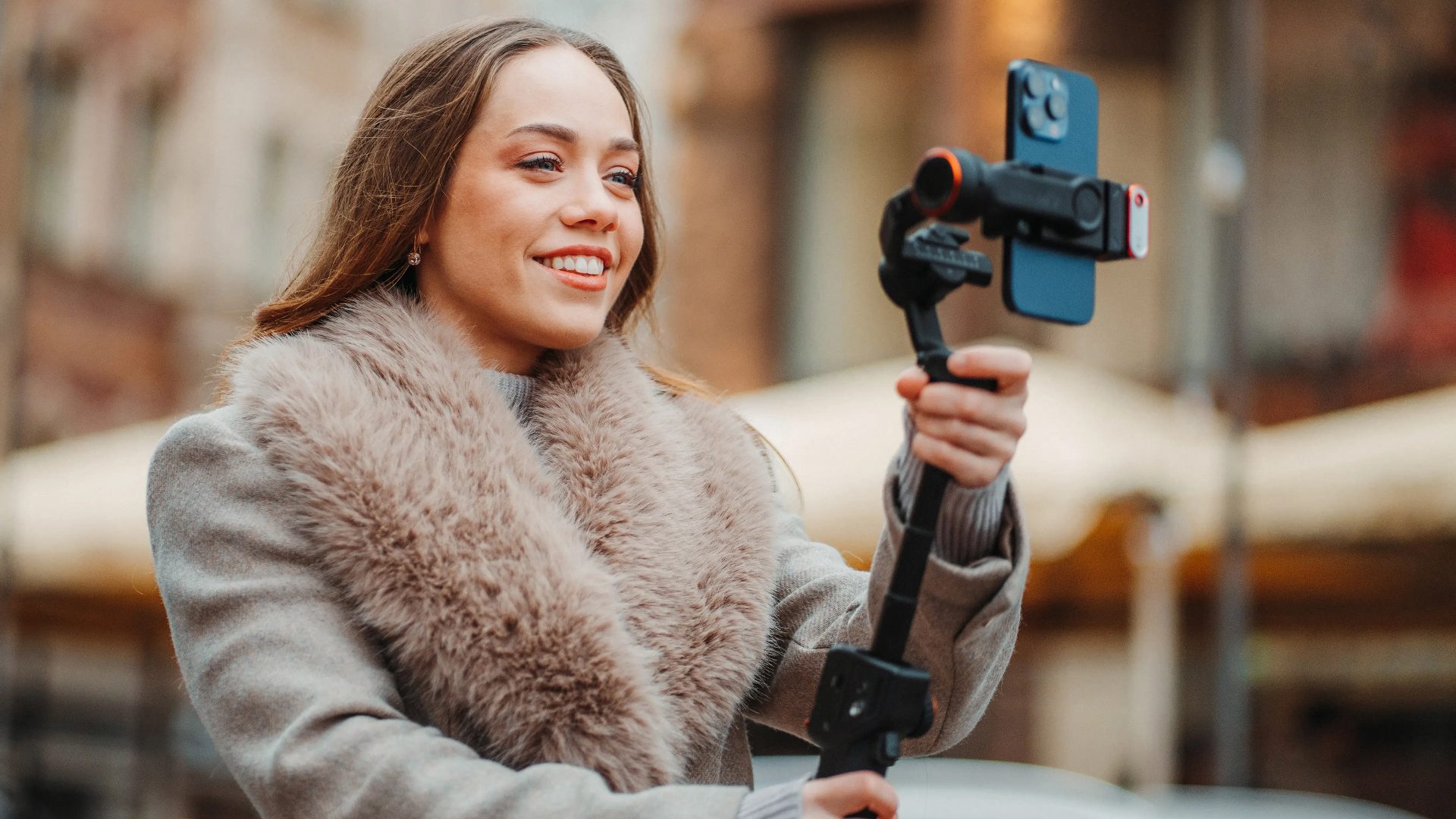 Hohem gimbal stabiliser for smartphones on display, showcasing professional video recording and camera equipment deals.