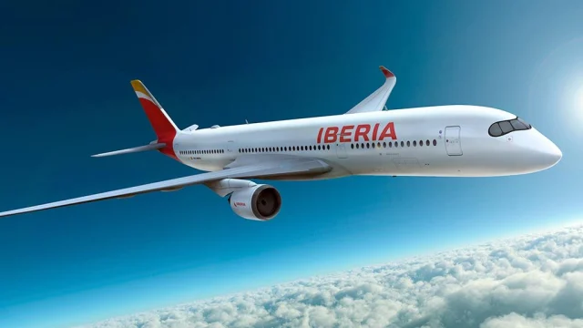 Iberia Airlines aircraft parked at a busy airport terminal, representing premium travel and flight booking deals.