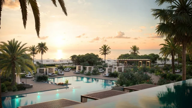 Luxury Iberostar hotel resort featuring a sunlit swimming pool and palm trees for an idyllic holiday getaway.