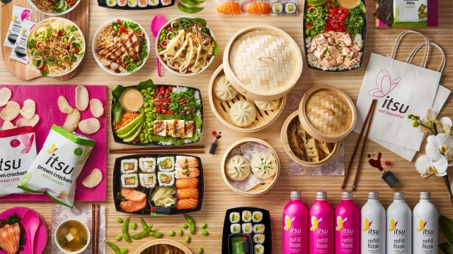 Itsu restaurant interior featuring healthy Asian-inspired takeaway meals and fresh sushi on display for customers.