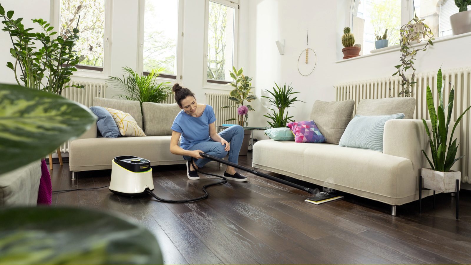 Kärcher pressure washer cleaning a patio, showcasing high-performance outdoor cleaning equipment for home maintenance.