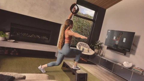 Les Mills fitness class participants exercising in a modern studio to improve health and wellbeing
