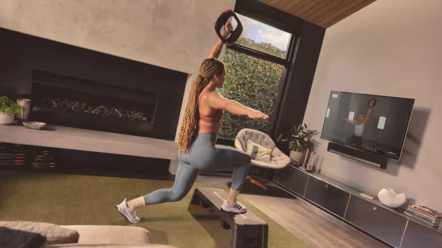 Les Mills fitness class participants exercising in a modern studio to improve health and wellbeing