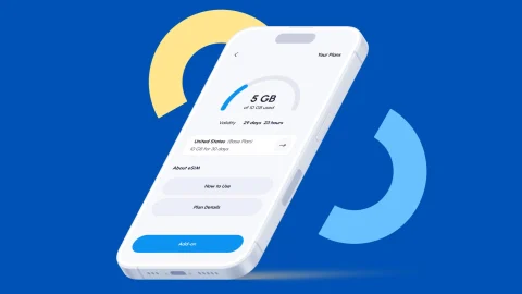 A digital nomad using a smartphone to manage travel data with Nomad eSIM for affordable global connectivity.