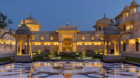 Luxury Oberoi Hotels exterior showcasing elegant architecture and landscaped gardens for a premium travel experience.