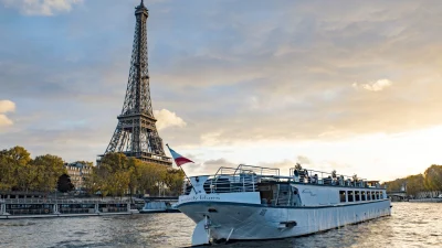 Scenic view of the River Seine in Paris with iconic architecture, perfect for booking a luxury river cruise experience.