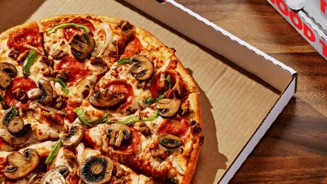 Pizza Hut UK delivery box with a freshly baked pepperoni pizza, highlighting current takeaway deals and offers.
