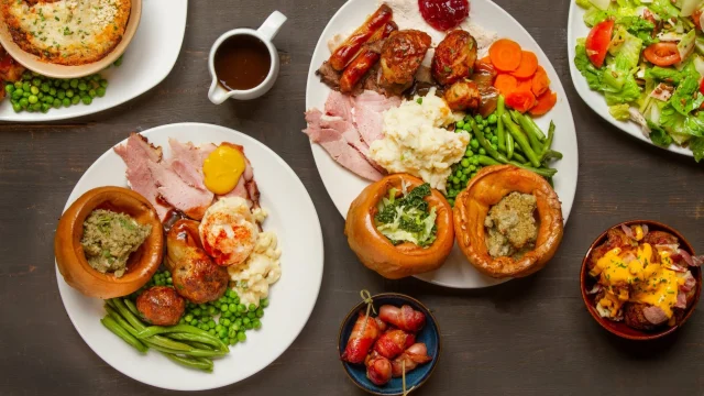 A delicious Toby Carvery roast dinner with carved meats and fresh vegetables, perfect for family dining deals.