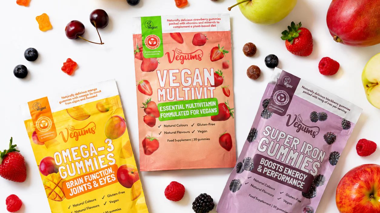 Vegums vegan multivitamin gummies in colourful packaging, promoting healthy plant-based supplements and special offers.