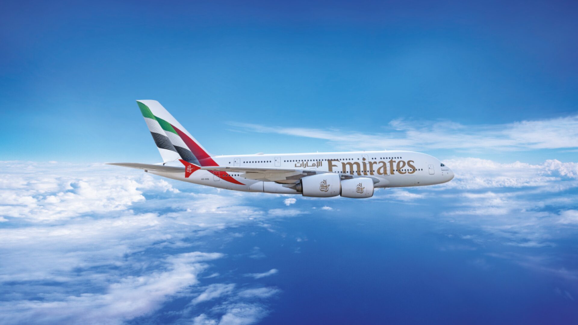 Emirates airline aircraft flying above clouds, representing luxury air travel and premium flight experiences.