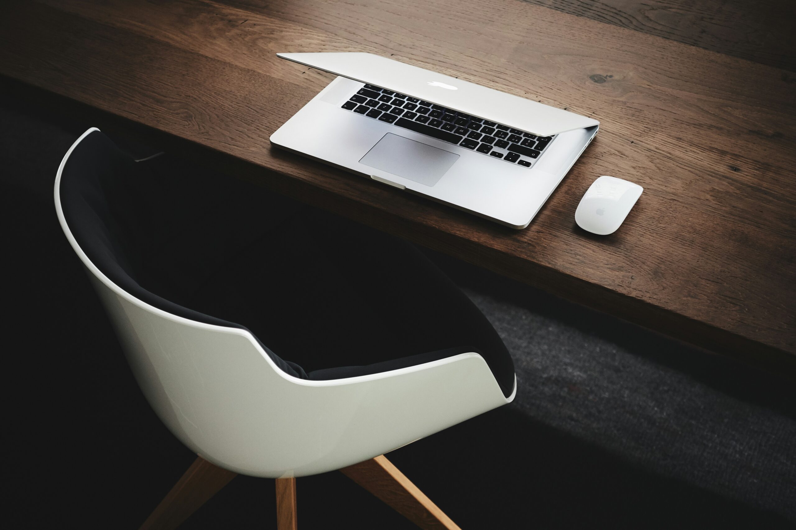 Modern laptop on a minimalist desk running Google Workspace productivity apps