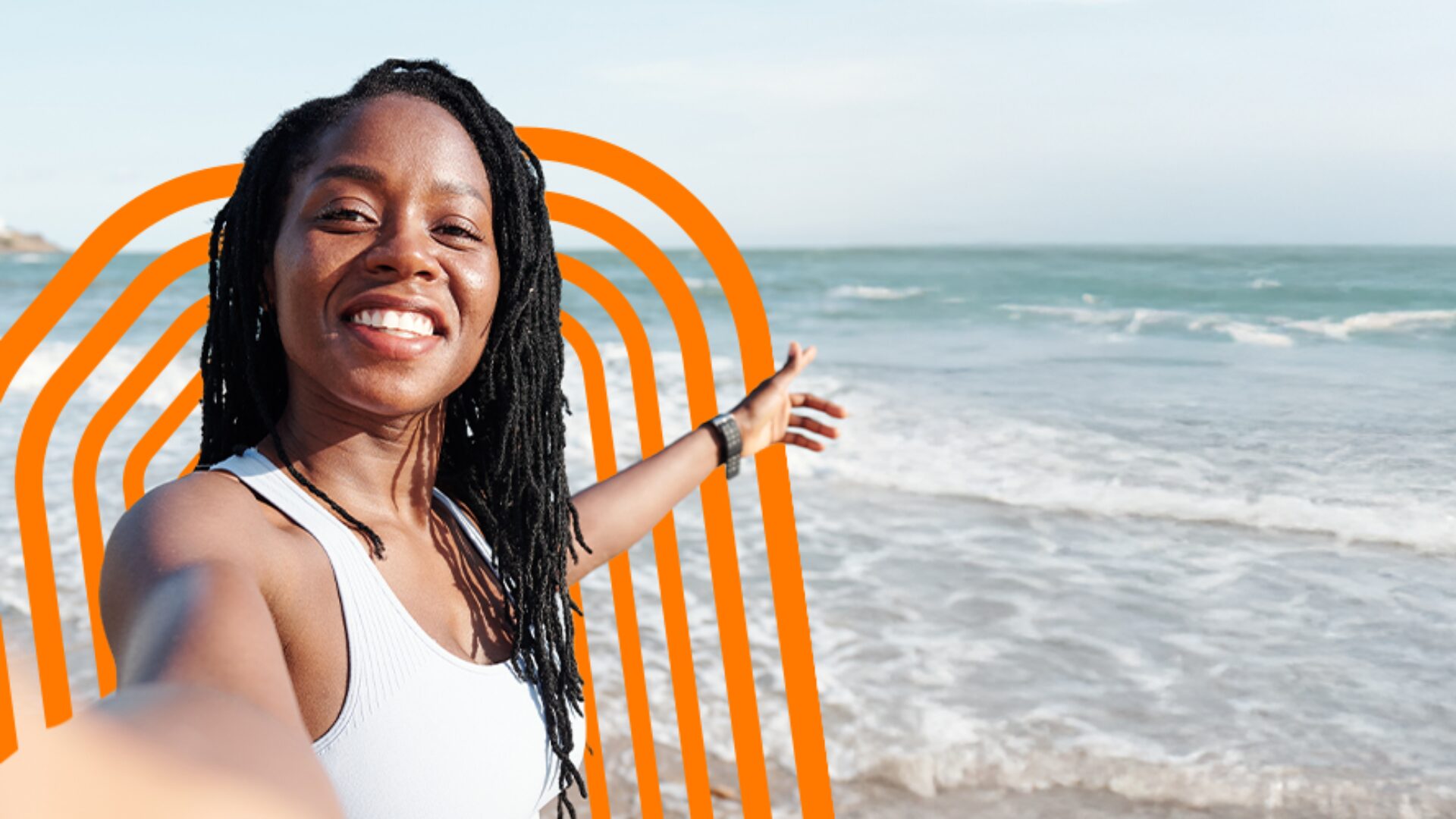 A smiling woman taking a selfie on a sunny beach with an orange graphic arch overlay representing Orange Travel eSIM.
